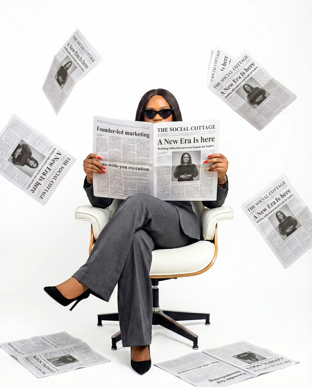 Founder of The Social Cottage seated, reading a newspaper announcing 'The Social Cottage: A New Era Is Here'